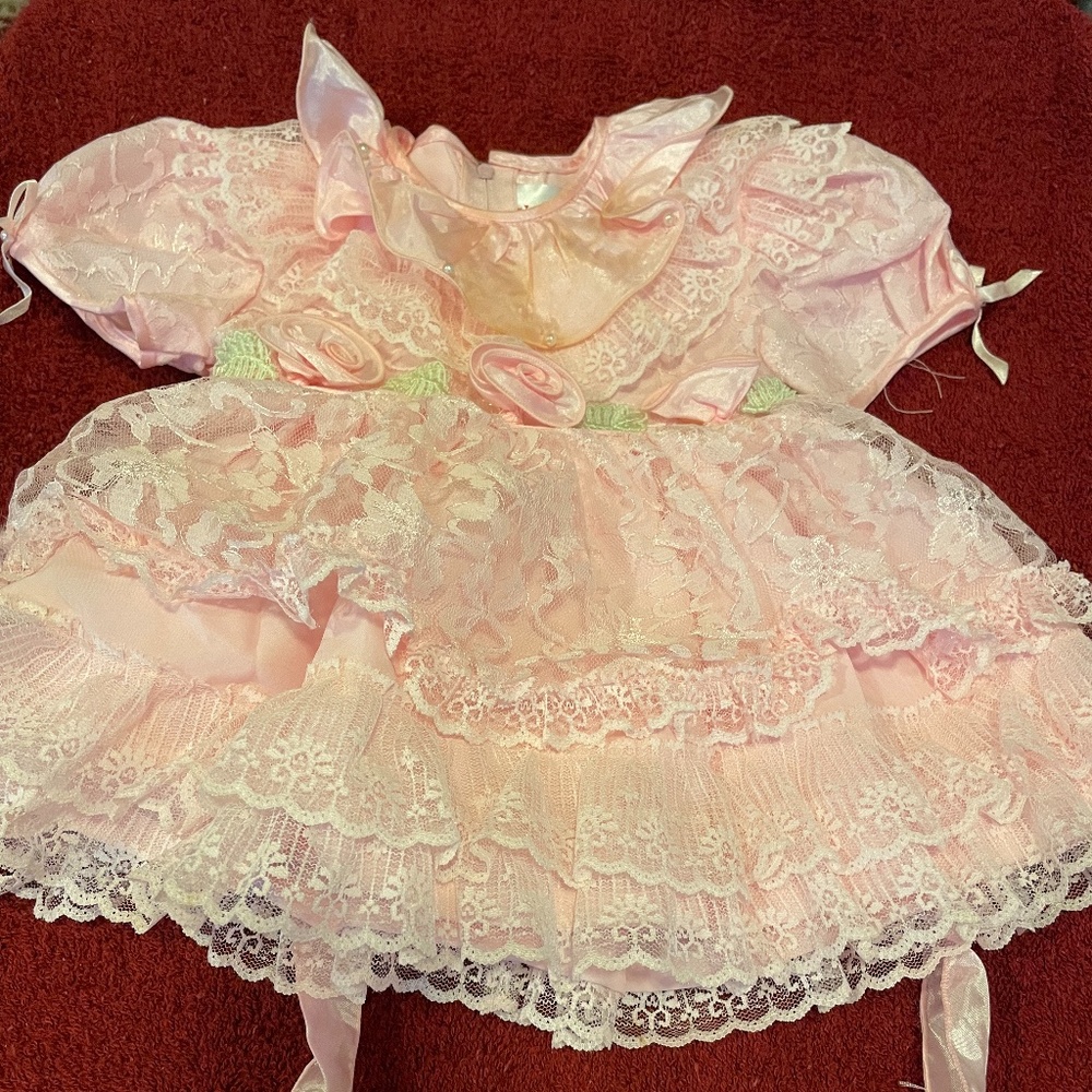 Pink toddler dress with lace and ruffles. 3 attached roses and leaves. 12M